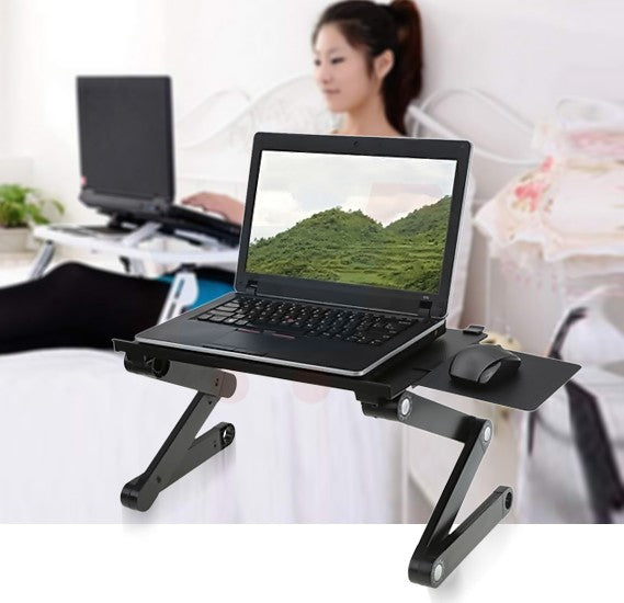 A woman sitting down using her laptop on an adjustable vented laptop stand, featuring ergonomic design and built-in cooling fans for optimal air circulation and overheating prevention, enhancing her work efficiency and comfort.
