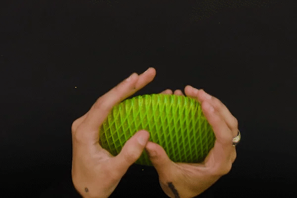 GIF of a person gently stretching the Fidgey™ toy in a soothing manner, demonstrating its flexibility and stress-relieving properties on a neutral background.