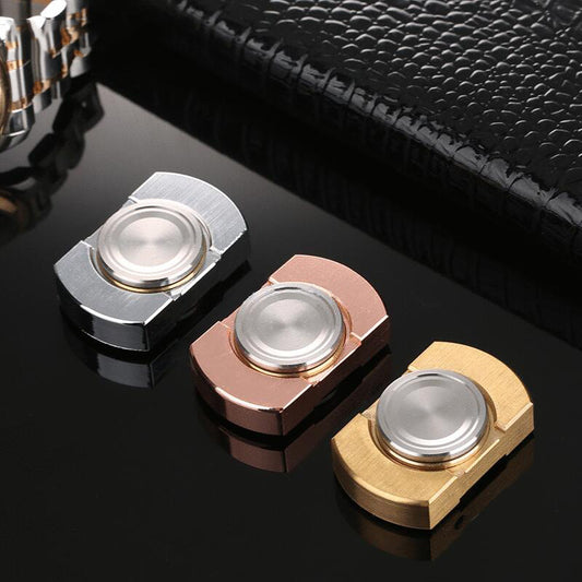 SpinZen™ fidget toys in silver, gold, and rose gold, elegantly arranged in a premium black setting. Crafted from durable stainless steel, ideal for stress relief and ADHD. Recognized as the 2023 Best Seller, portable and discreet for on-the-go relaxation.