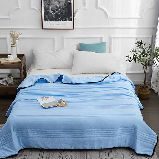 Blue variant of cooling bed sheets, crafted from breathable, eco-friendly bamboo and organic cotton blend, designed to regulate body temperature and reduce night sweats. Certified quality meets OEKO-TEX & CertiPUR-US standards for a restorative and hypoallergenic sleep experience.