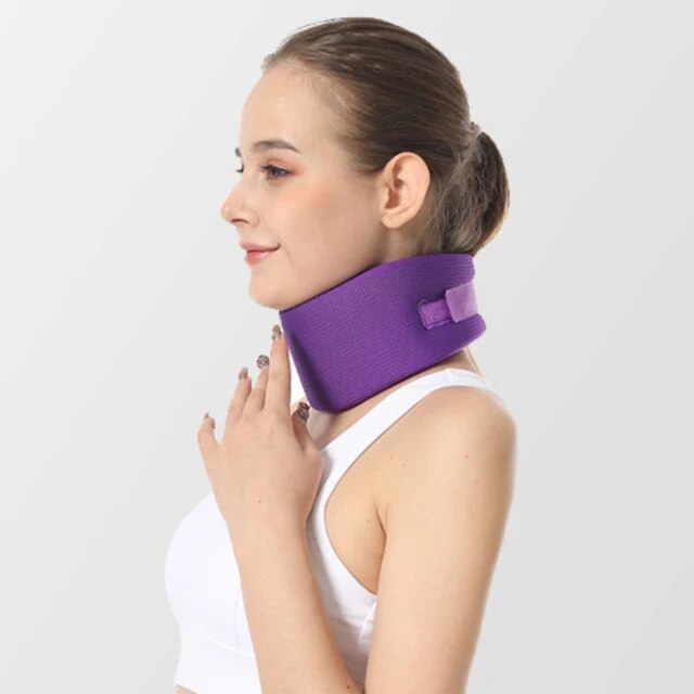 Side view of a middle-aged woman wearing the purple CerviRest Neck Brace, demonstrating its sleek design and comfortable fit. Crafted from hypoallergenic foam with adjustable support levels, this neck brace promotes restful sleep and aids in alleviating neck pain.