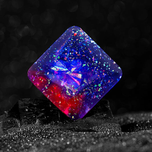 Orion variant of the GalacticFlipper™ fidget toy, featuring a cube design with vibrant red and blue patterns and embedded stars, symbolizing the Orion constellation. This high-quality, environmentally friendly resin cube is engineered for quiet operation and cognitive enhancement, ideal for office or classroom use.