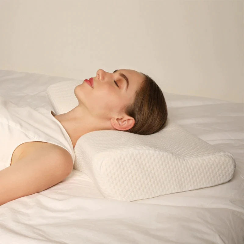 Woman sleeping on a Comfortable cervical pillow for reducing neck stiffness and stop snoring